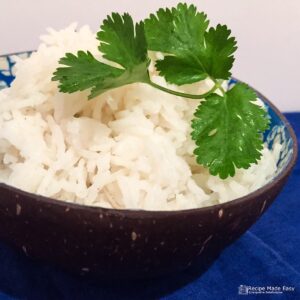 Bowl of basmati rice garnished with coriander.