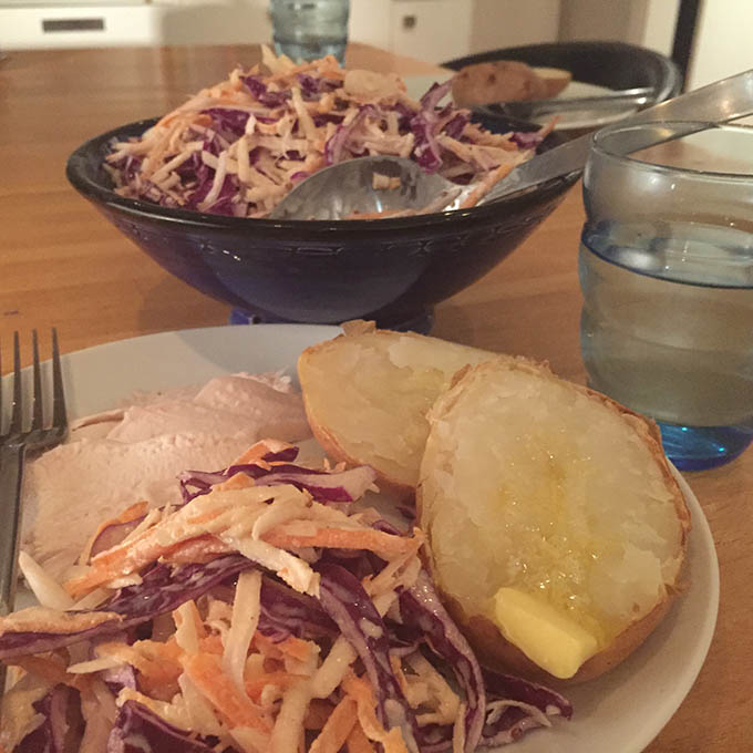 coleslaw served with jacket potato and cold meat