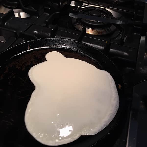 small amount of batter in frying pan.
