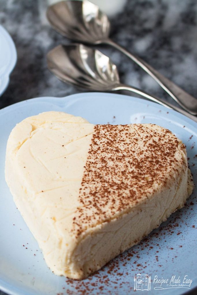 white chocolate parfait heart on blue plate