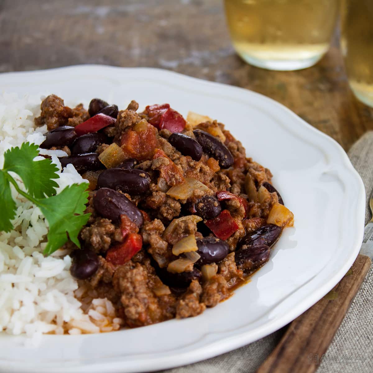 easy chilli con carne served with rice on a white plate.