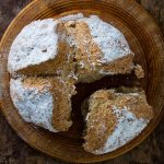 irish soda bread with portion part removed.