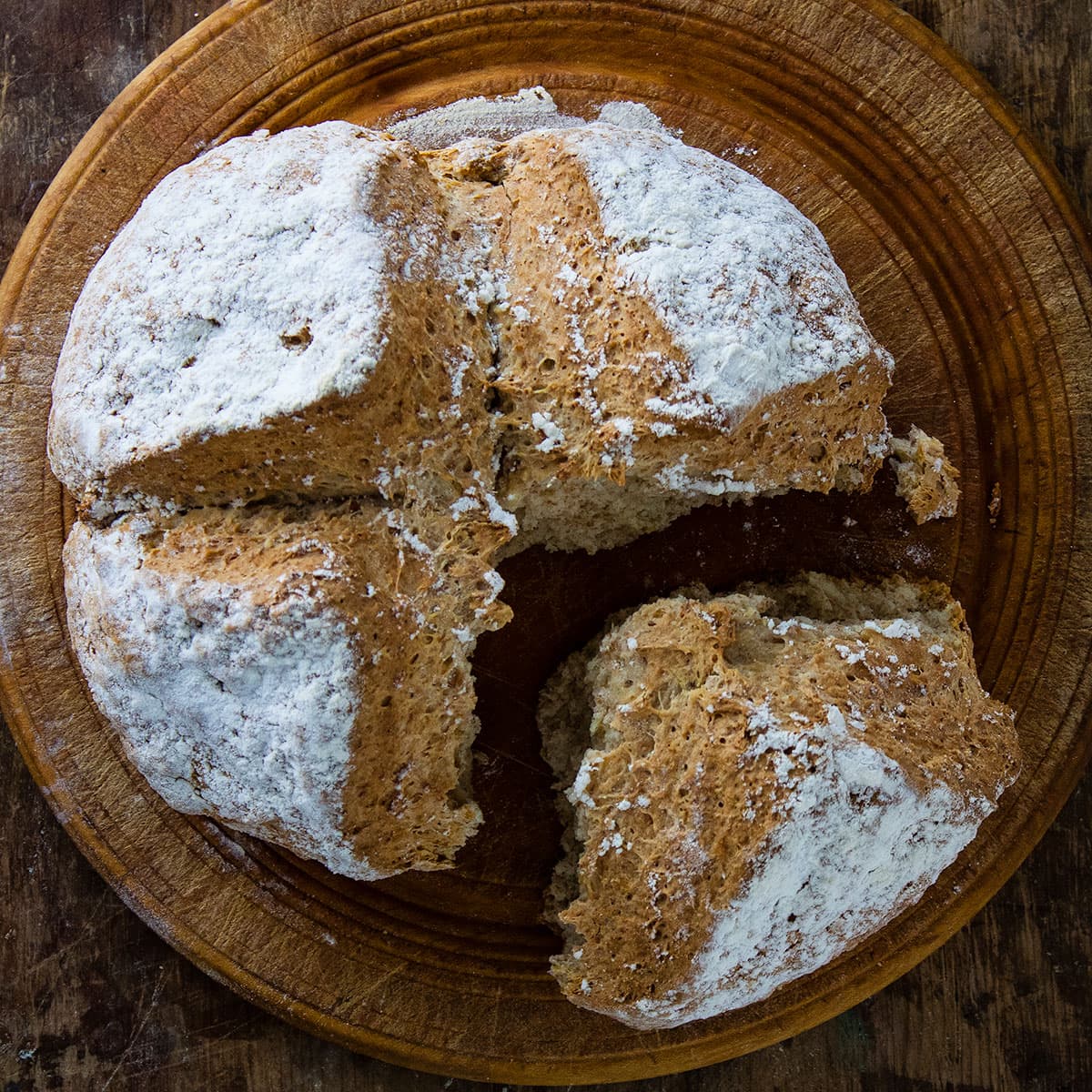 irish soda bread with portion part removed.