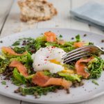 A perfect winter or spring salad of lentils and savouy cabbage, served topped with smoked salmon and a poached egg.