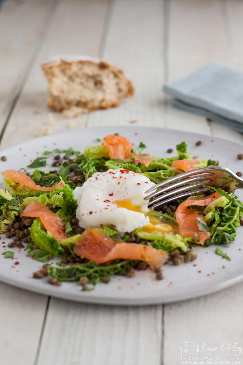 A perfect winter or spring salad of lentils and savouy cabbage, served topped with smoked salmon and a poached egg.