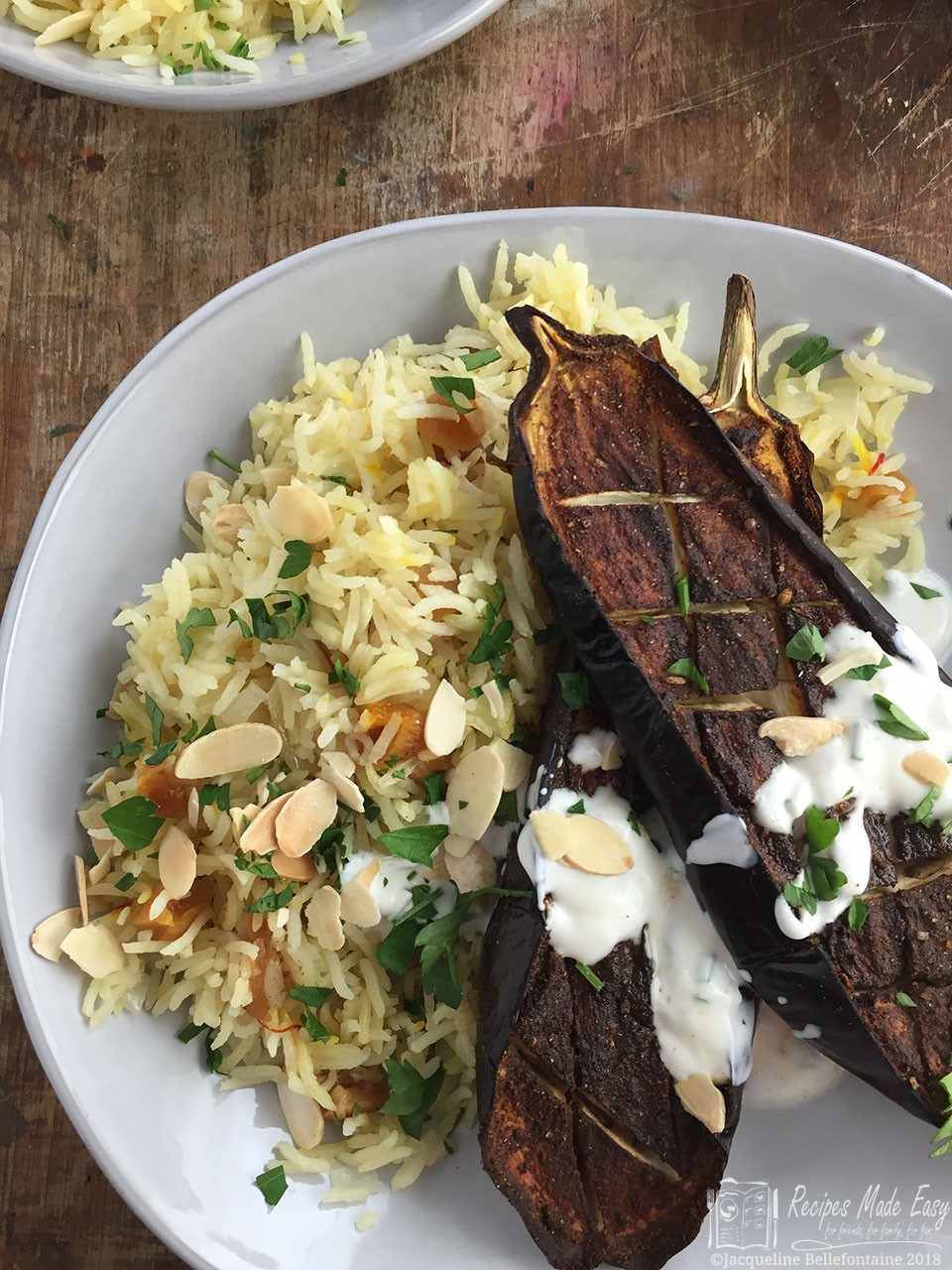 roast aubergine with saffron rice and yogurt dressing,