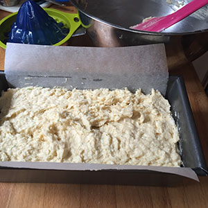 uncooked cake mixture in tin.