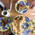 looking down on Dutch apple pie sliced and served on tea plates.