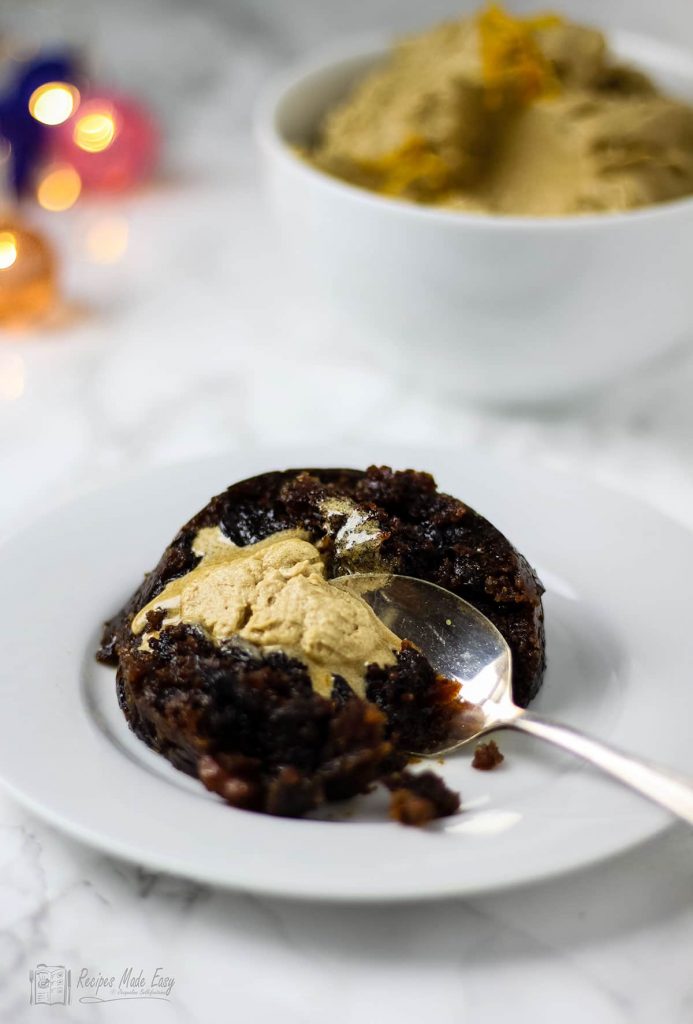 brandy butter on portion of Christmas pudding.