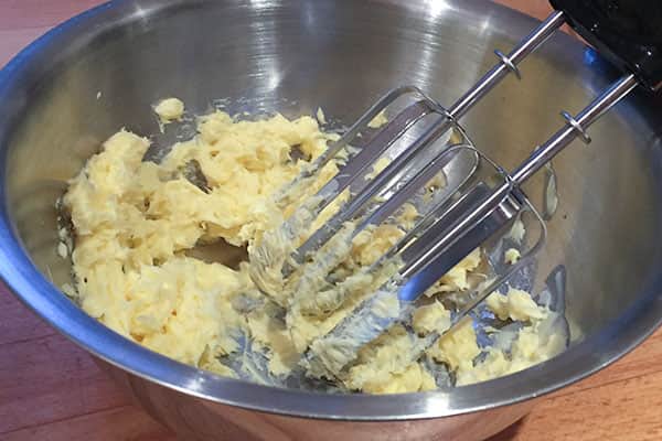 beaten butter in mixing bowl.