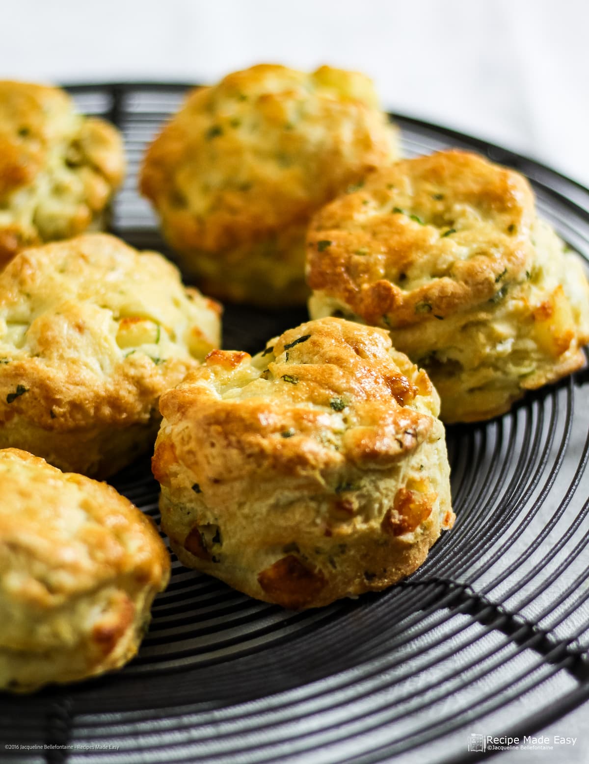 Haloumi and Mint scones on a round cooling rack.