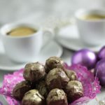 plate of prosecco truffles with coffee cups in background