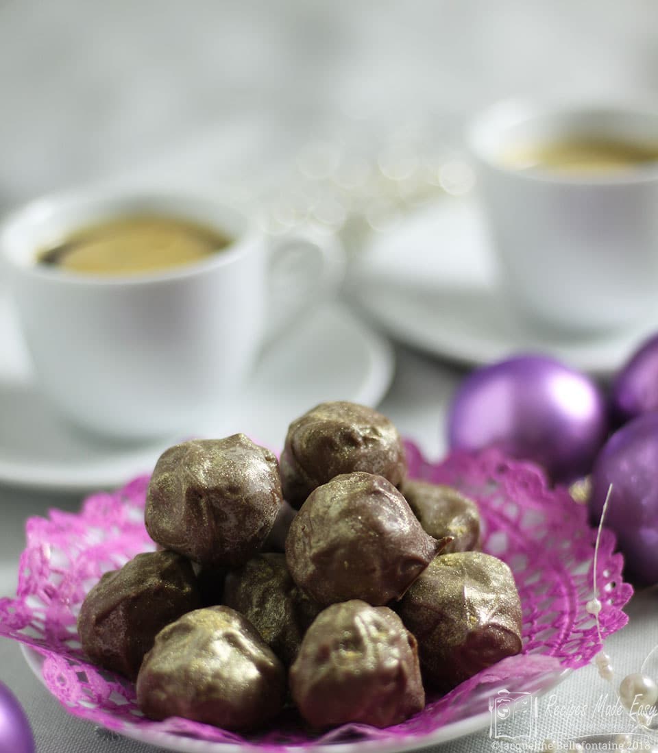 plate of prosecco truffles with coffee cups in background