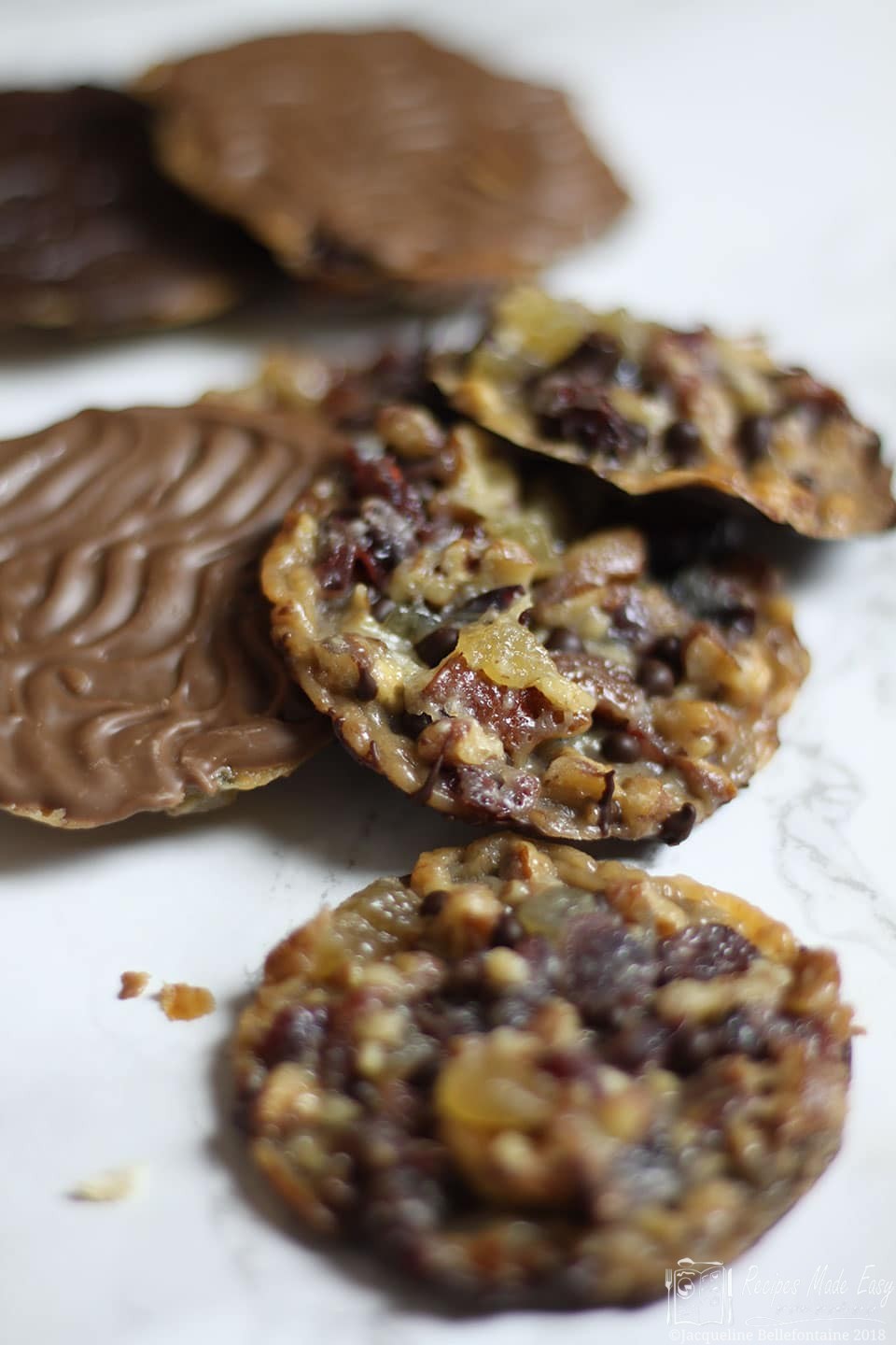 Pecan, Ginger and Cranberry Florentines on a marblebackground