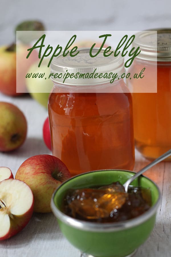 jars of apple jelly behind apple jelly in bowl