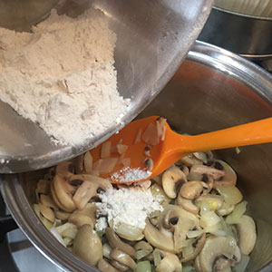 Once the mushrooms have softened stir in the flour and cook for 1 minute. deep filled chicken and mushroom pie by recipesmadeeasy.co.uk