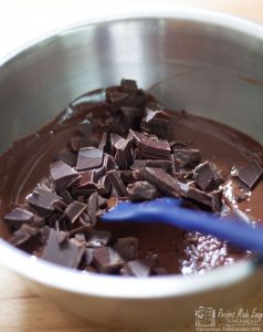 Temper the chocolate adding remaining "seed" chocolate.