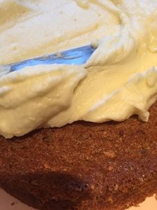 Spread the mascarpone cream over the top and sides of the cake. Spread the mascarpone cream over the top and sides of the cake.