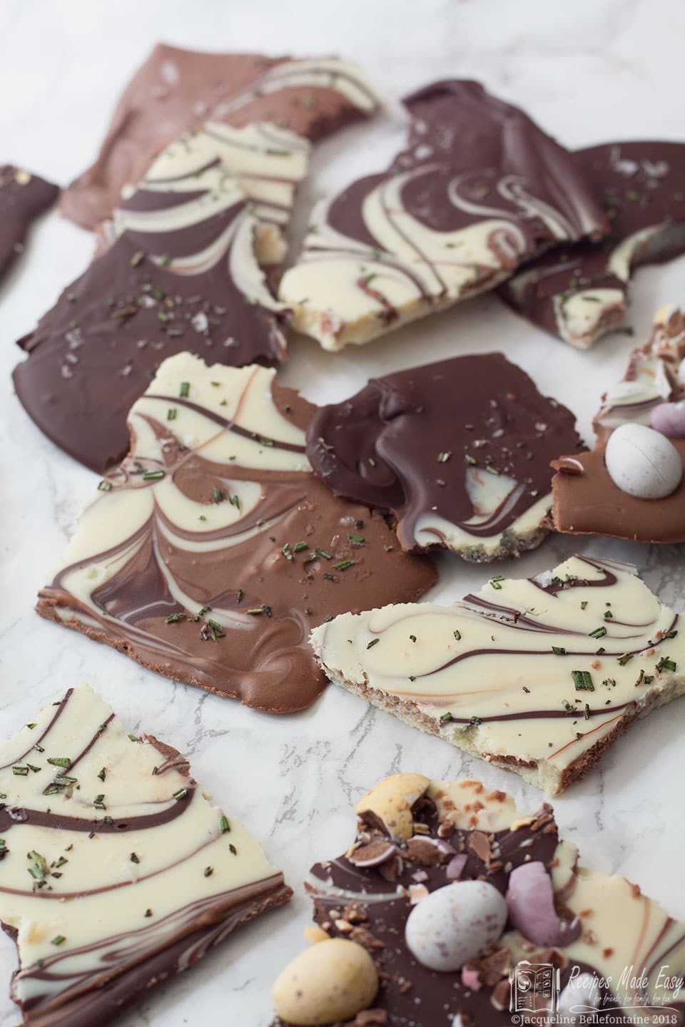 Broken pieces of Triple Chocolate Bark by Recipes Made Easy