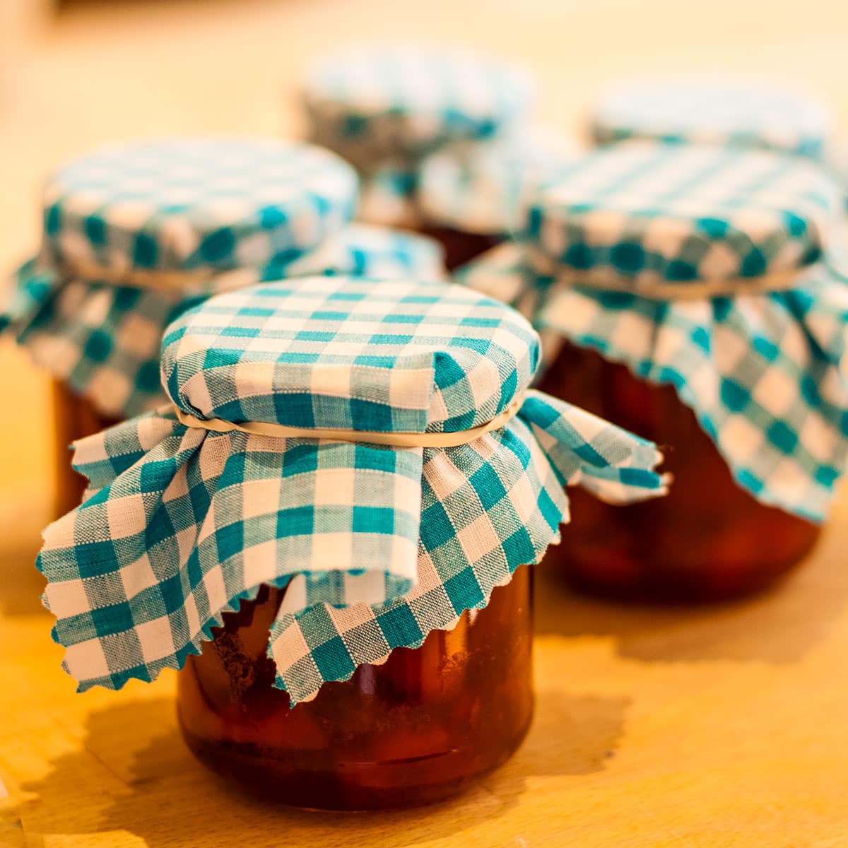 jars of preserves with gingham tops