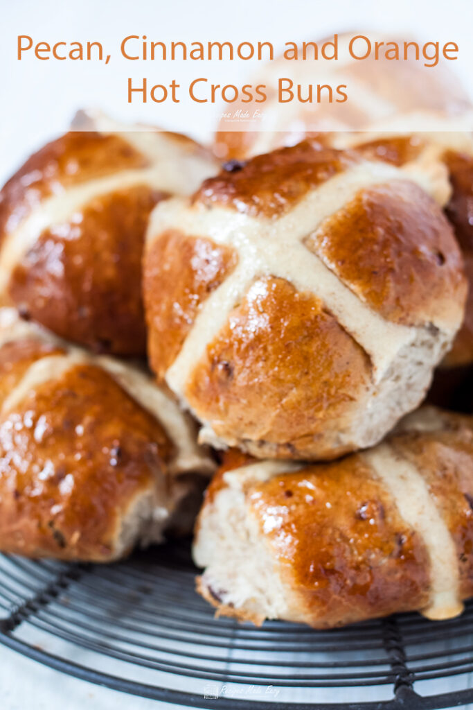 hot cross buns piled on wire plate.