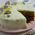 pistachio and lime cake with sliced removed.