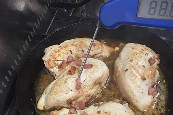 Cooked chicken in pan.