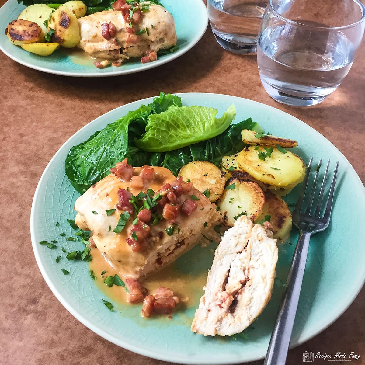 recipes made easy feta stuffed chicken, on a plate cut open