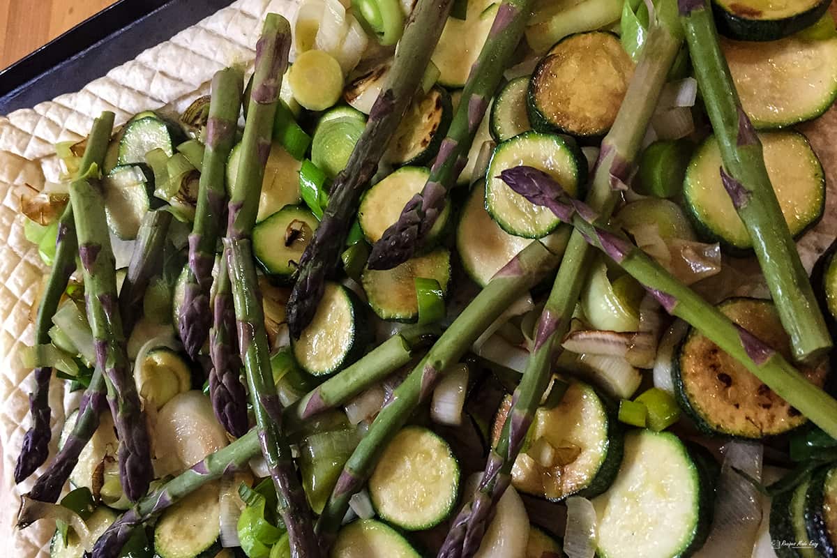 vegetables piled into the cenmtre of the tart.