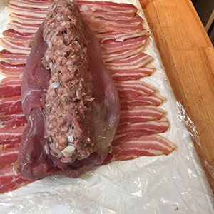 Place the stuffing down the centre of the tenderloins. stuffing down centre of the pork tenderloin