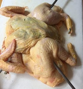 Thread two skewers through the chicken to hold in shape. Thread two skewers through the chicken to hold in shape.