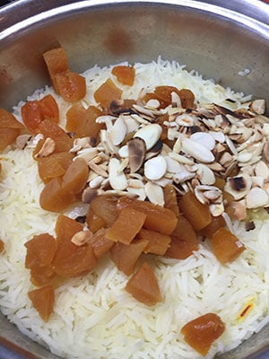 Add the apricots and almonds. Add the apricots and almonds.
