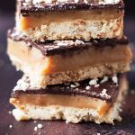 stack of hazelnut Millionaires shortbread with rum caramel by Recipes Made Easy