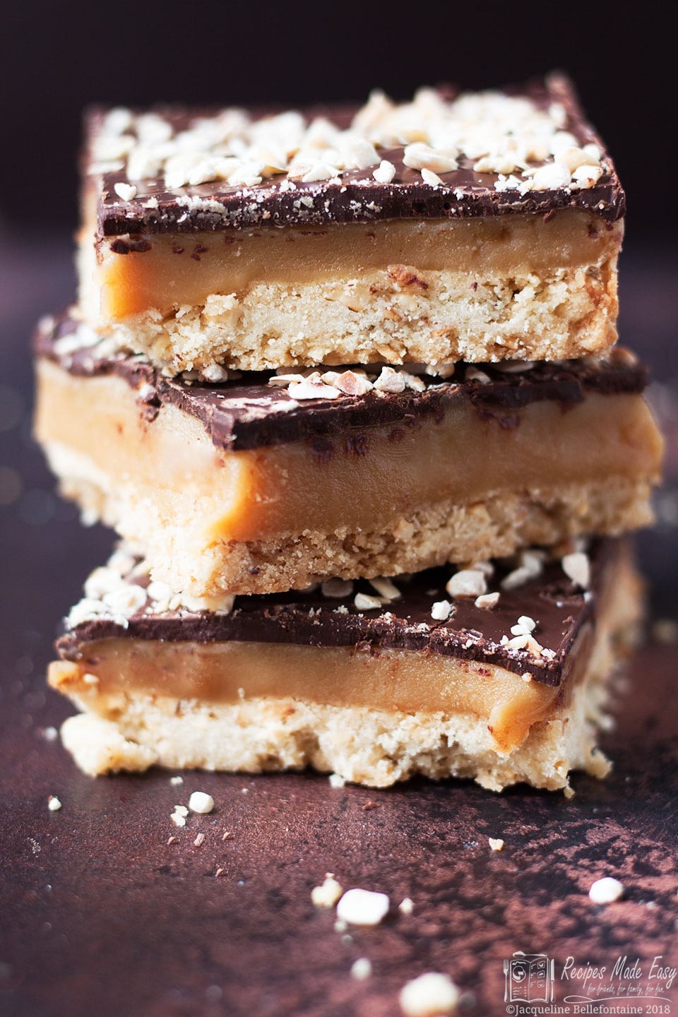 stack of hazelnut Millionaires shortbread with rum caramel by Recipes Made Easy