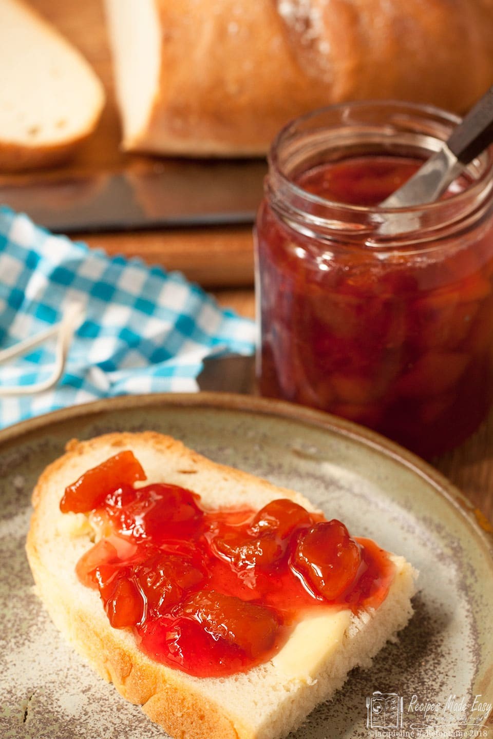 peach and Pomegranate jam spread onto bread by recipes made easy