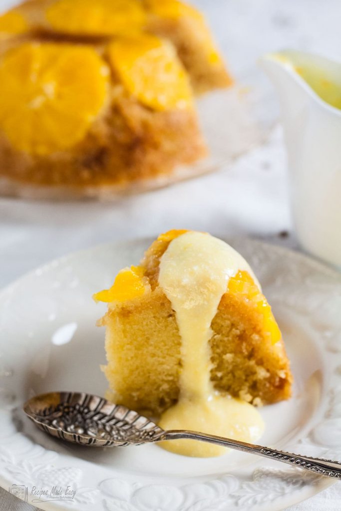 Slice of orange and stem ginger pudding with orange foam sauce poured over. Recipes Made Easy