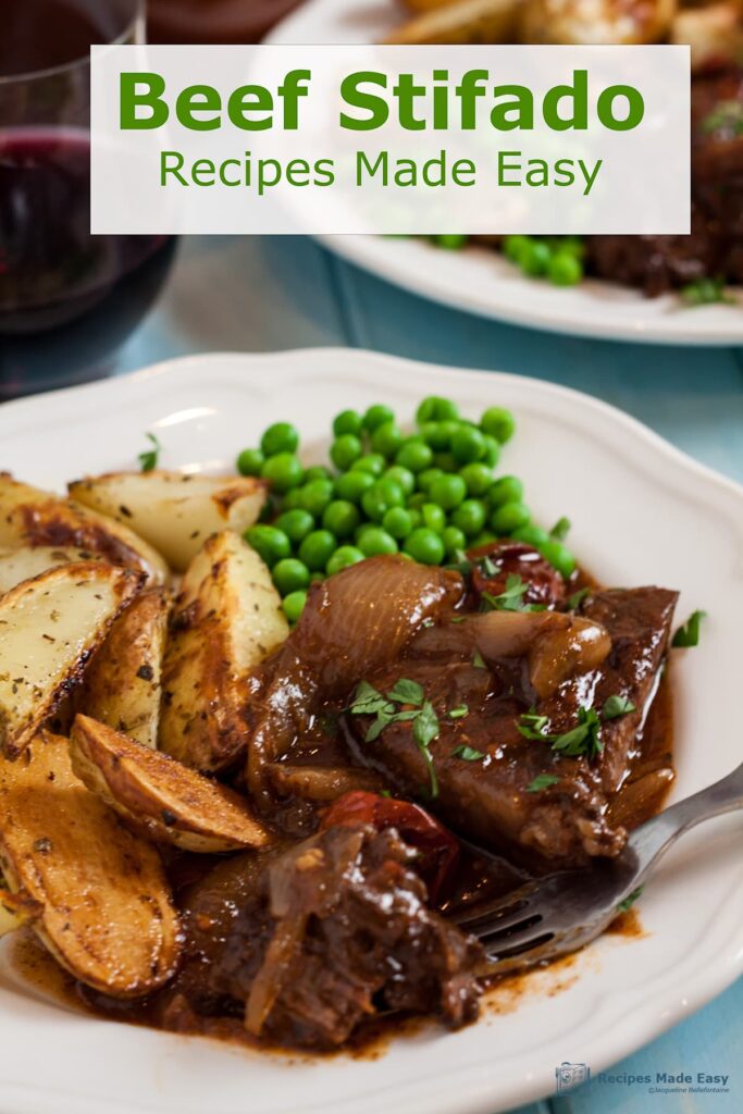 plate of beef stifado with peas and oven chips 2nd plate in back ground.