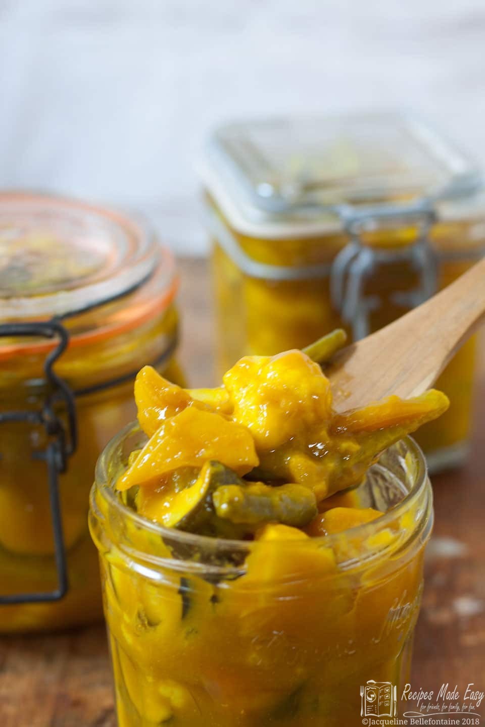 spooning piccalilli from jar