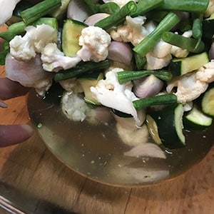 draining the vegetables