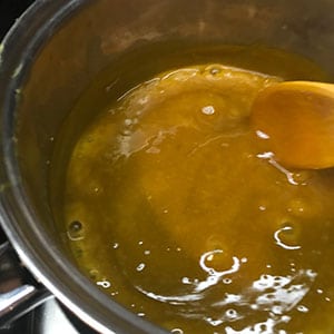 stirring the thickening sauce