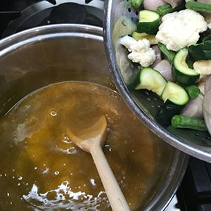 adding the vegetables
