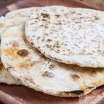 flatbreads on a wooden tray