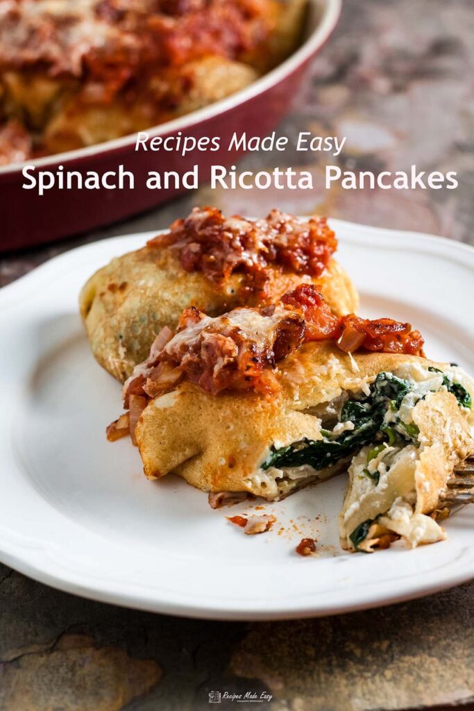 2 baked spinach and ricotta pancakes on a plate