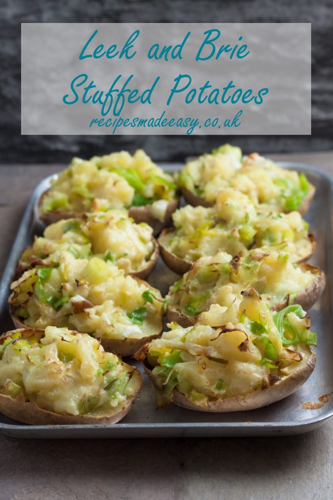 leek and brie stuffed potatoes on a baking sheet.