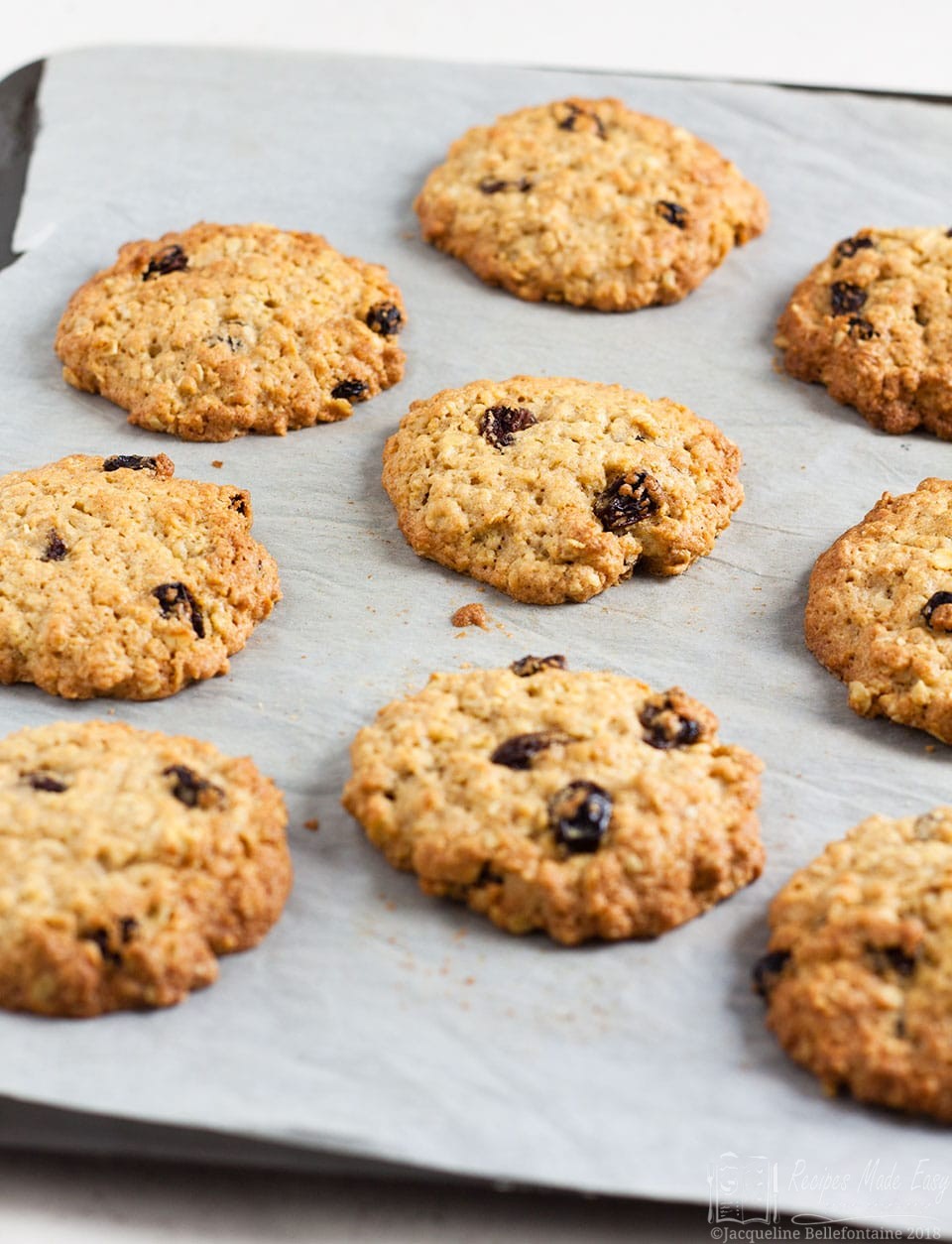 oat and raisin cookies on a baking sheet