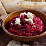 beetroot hummus in abowl topped with feta cheese