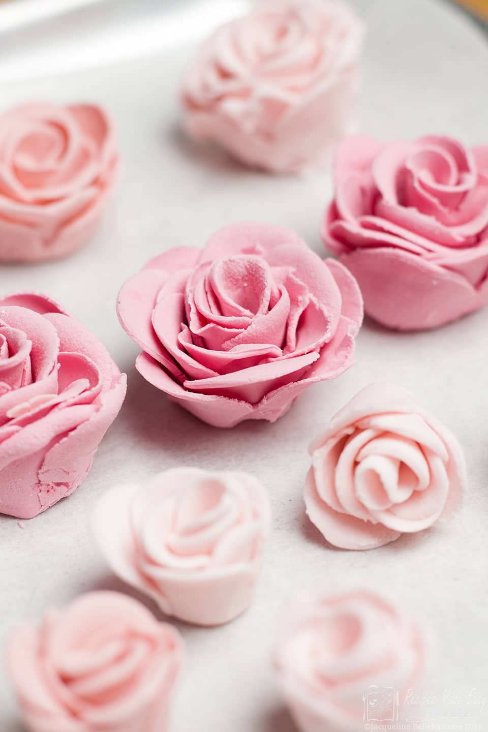 Sugar roses on a baking sheet