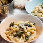 bowls of creamy pasta with asparagus and bacon