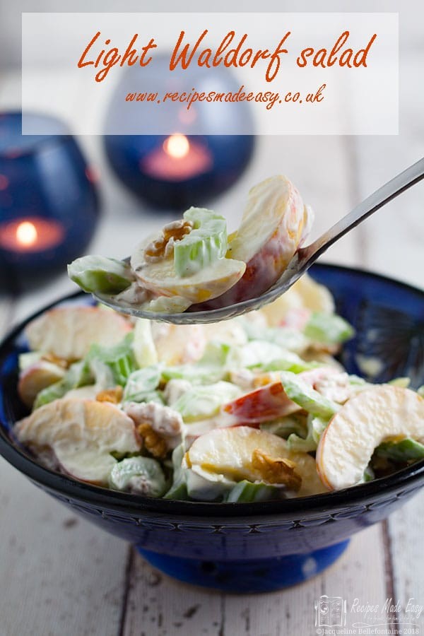 wardolf salad in a bowl with spoonful being lifted out