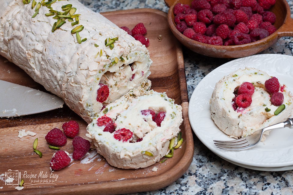 Pistachio, raspberry and lemon meringue roll | Recipes Made Easy